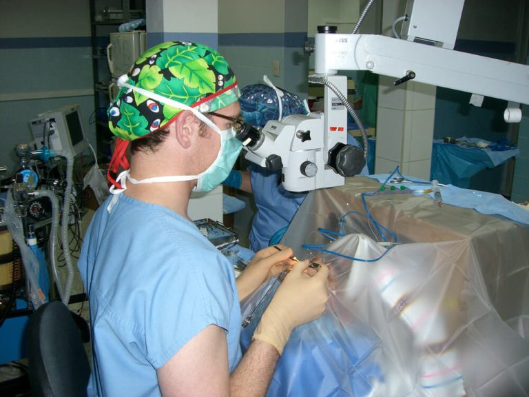 A photo of Dr. Landmann using a slit lamp on a cataract patient in Guatemala.