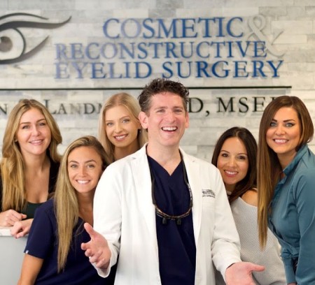 Dr. Dan S. Landmann and his staff smiling; Cosmetic & Reconstructive Eyelid Surgery at River Edge, New Jersey.