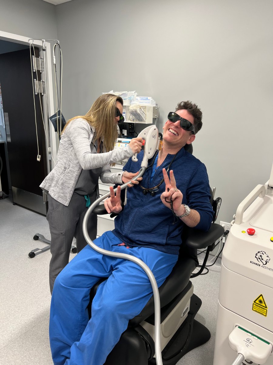 Nichole doing an IPL-Intense Pulse Light treatment on the neck of Dr. Dan Landmann.